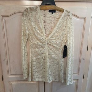 Karen Kane XL,  cream colored lace top. Long sleeve with a plunging v neckline.